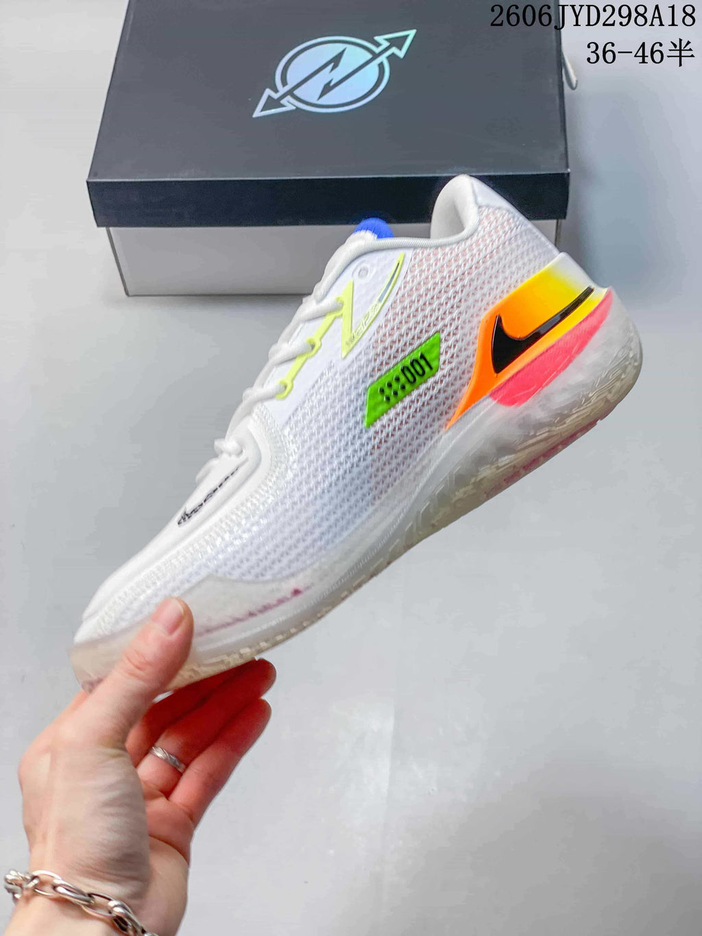 Side view of the white shoe with neon green, orange, red, and black details.