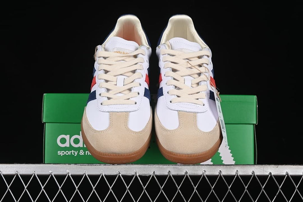 Front view of the pair showing cream laces and sand-colored toe overlays