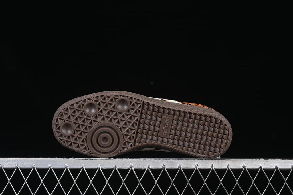 Underside view of the dark brown patterned outsole