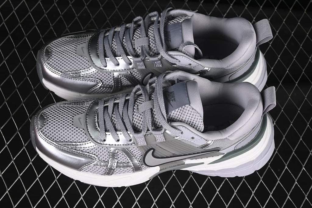 Pair of silver and grey Nike V2K Run sneakers viewed from above