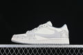 Side view of an off-white and grey low-top sneaker with snake-patterned overlays and a light grey side Swoosh.