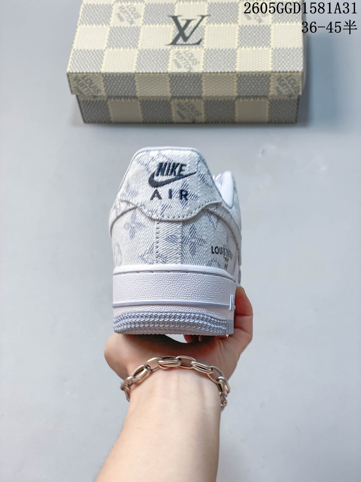 Rear view of a white and grey patterned Nike low-top sneaker