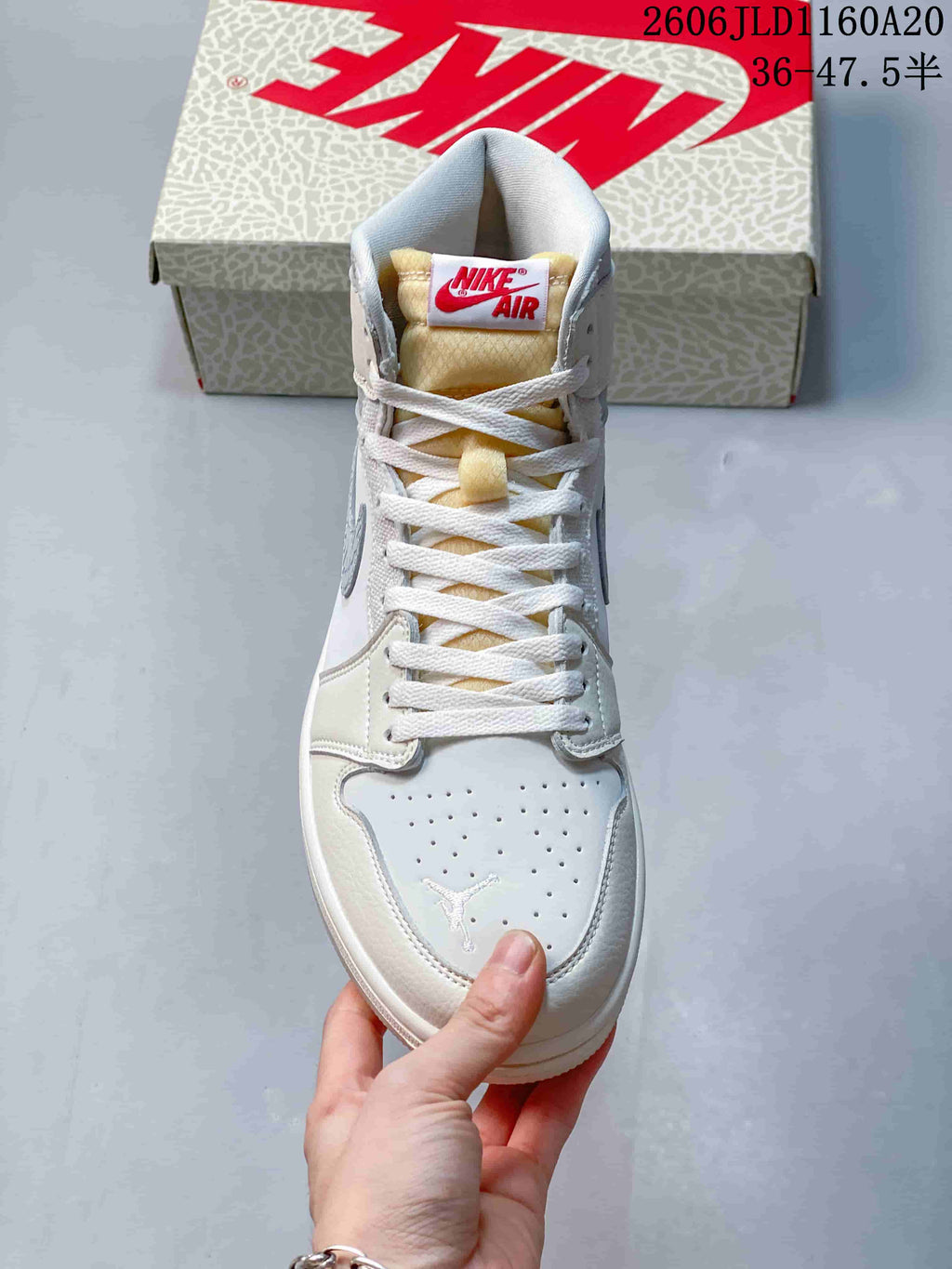 Front view of the sneaker showing perforated toe and laces