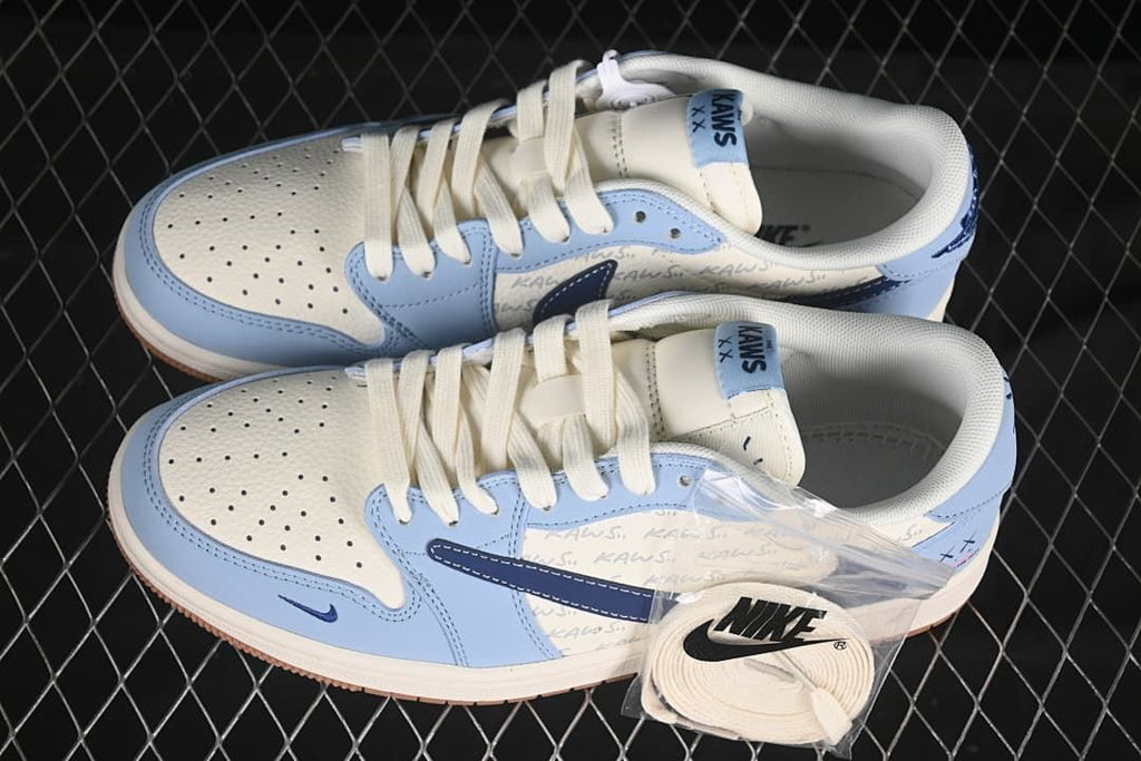 Overhead view of a pair of light blue and off-white low-top sneakers with an extra pair of laces