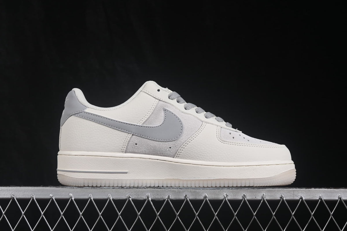 Opposite side profile showing the white upper, gray Swoosh-style detail, and gray overlay.