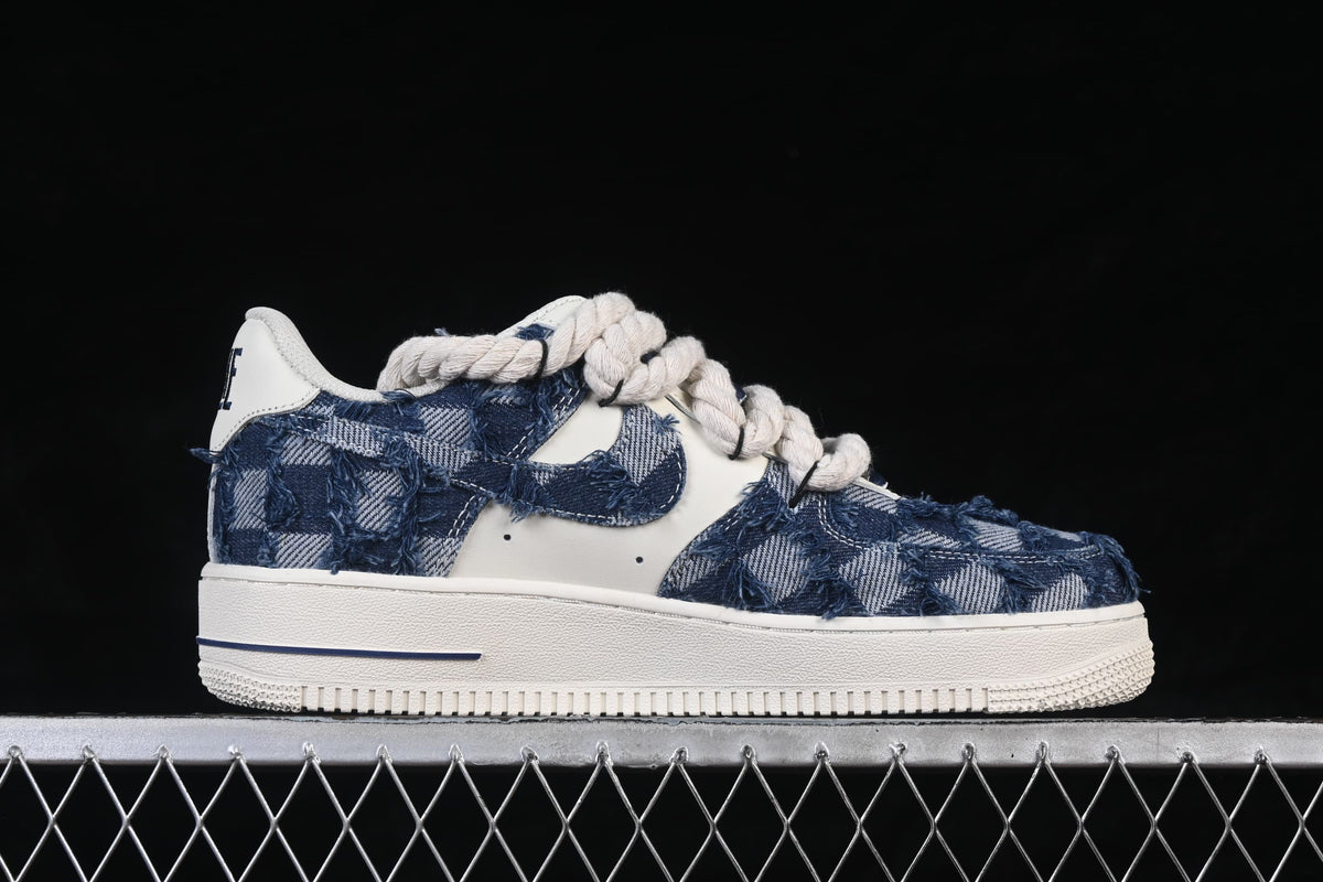 Side profile highlighting the denim-style panels, Swoosh-shaped detail, and off-white sole