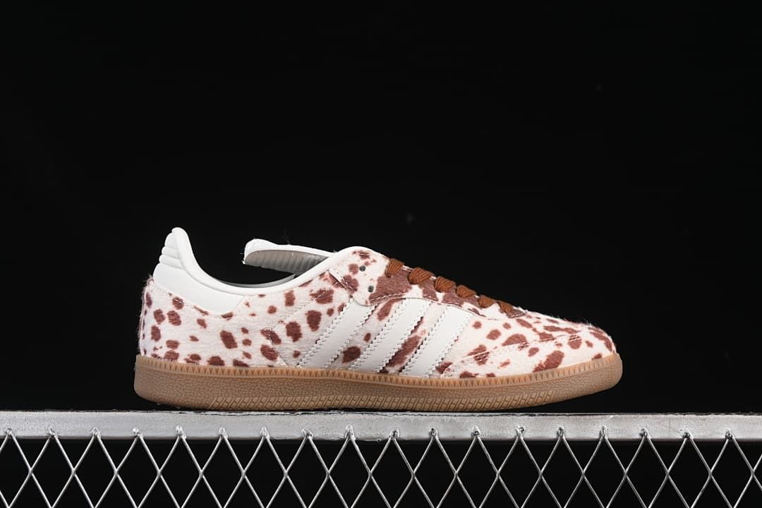 Side profile of a spotted low-top sneaker with white stripes and gum sole