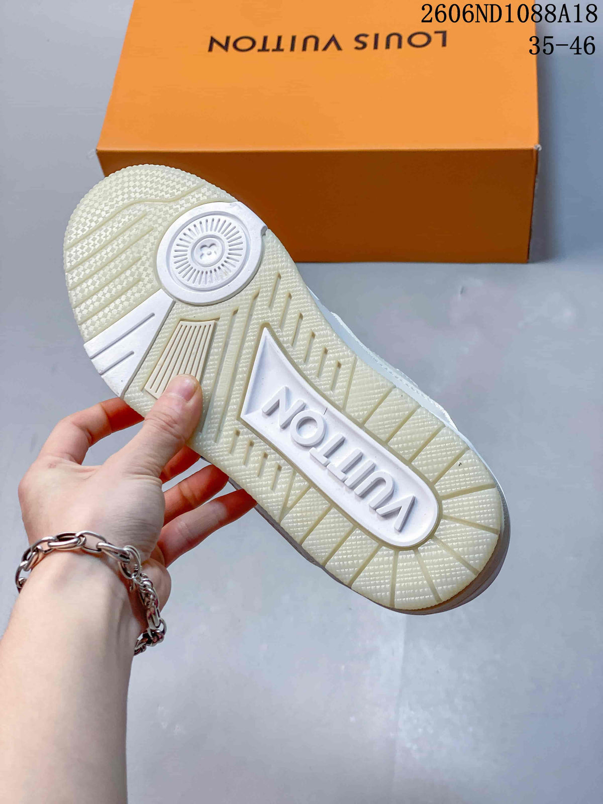 Close-up of the patterned outsole on a white Louis Vuitton Trainer sneaker