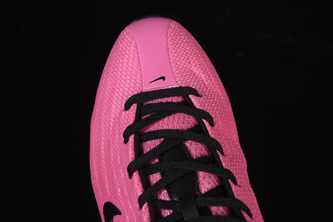 Top-down view of the pink toe and black laces
