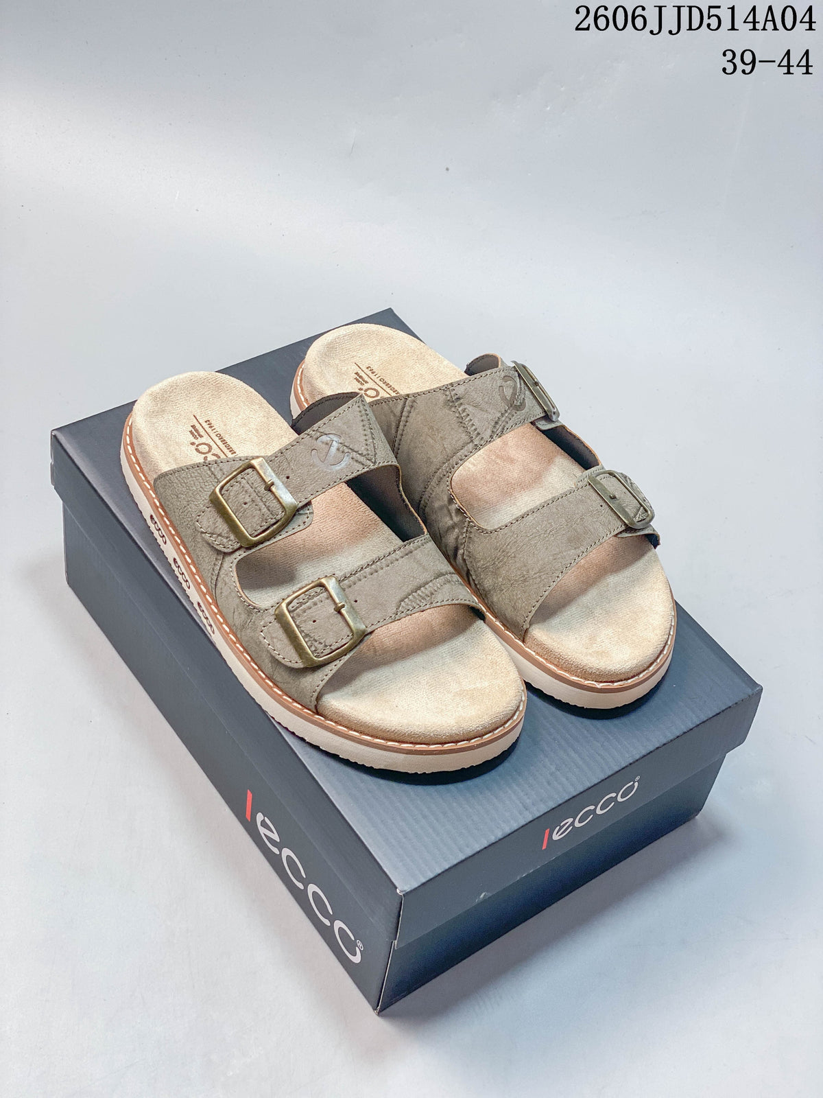 Pair of taupe two-buckle slide sandals displayed on an ECCO-branded box; image overlay shows 06JJD514A04 and sizes 39–44.