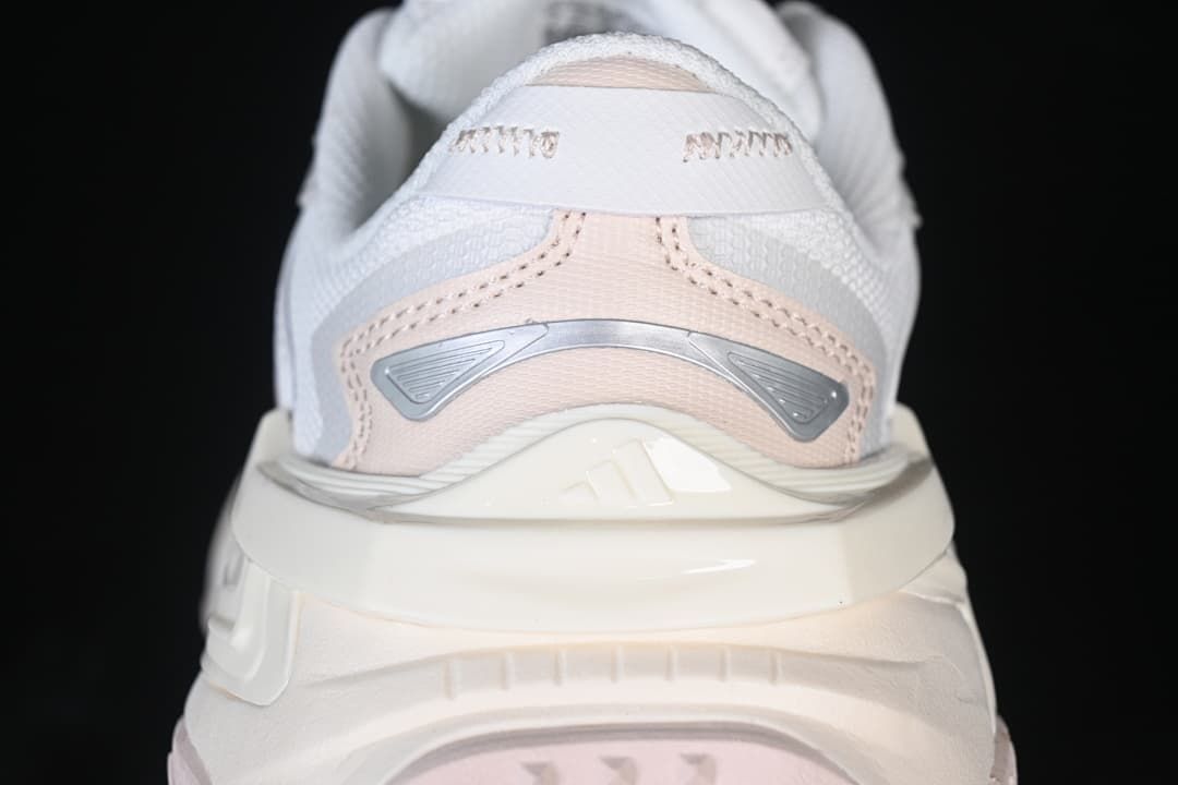 Rear close-up of the sneaker with pink and silver-gray heel details