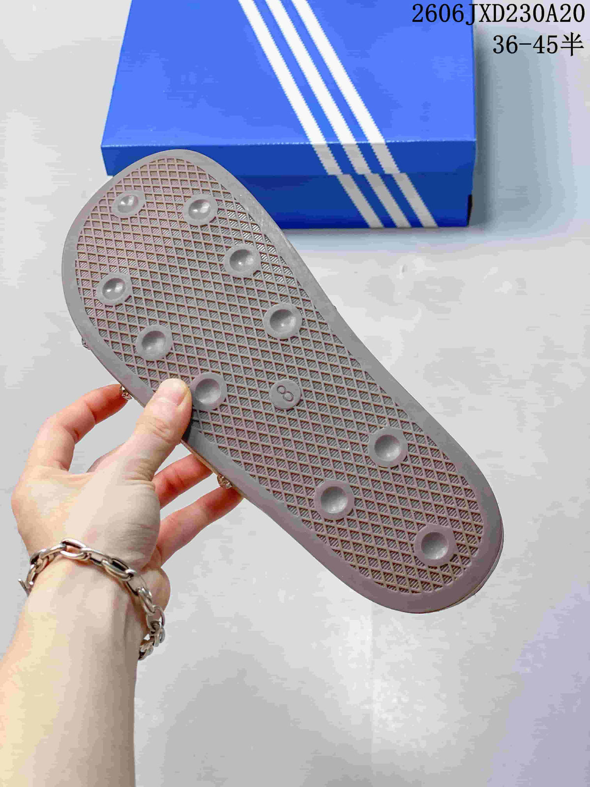 Outsole view of a tan adidas Adimule mule slide