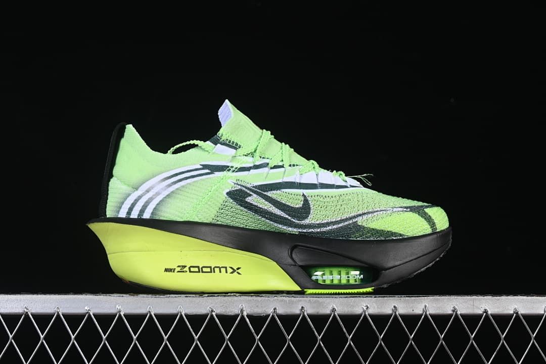 Side profile showing the sculpted green and black midsole