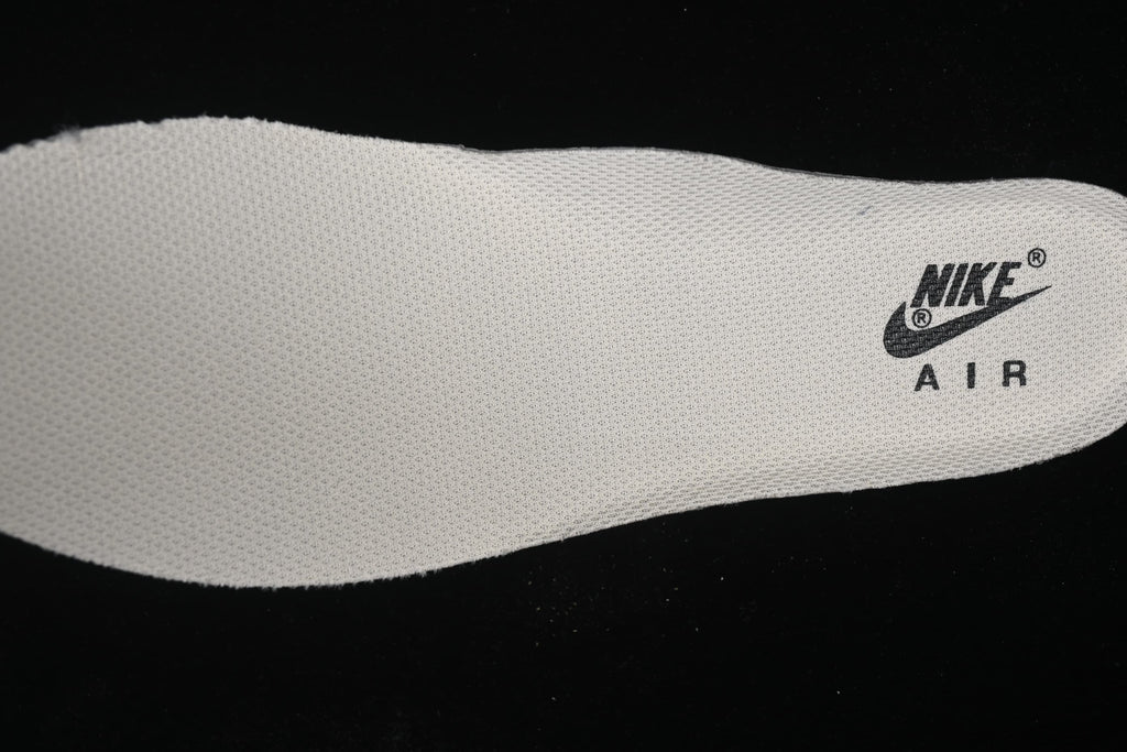 Close-up of a light-colored insole with printed Nike Air branding