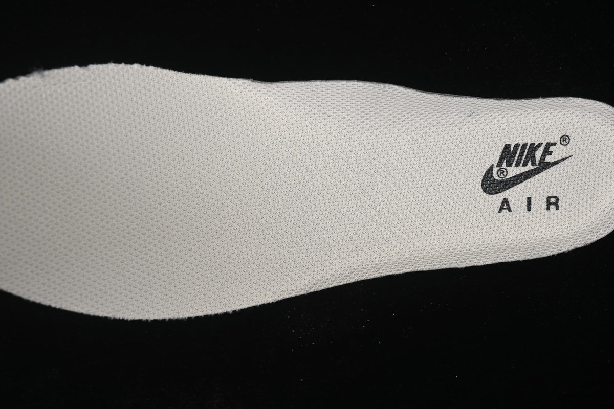 Close-up of a light-colored insole with printed Nike Air branding