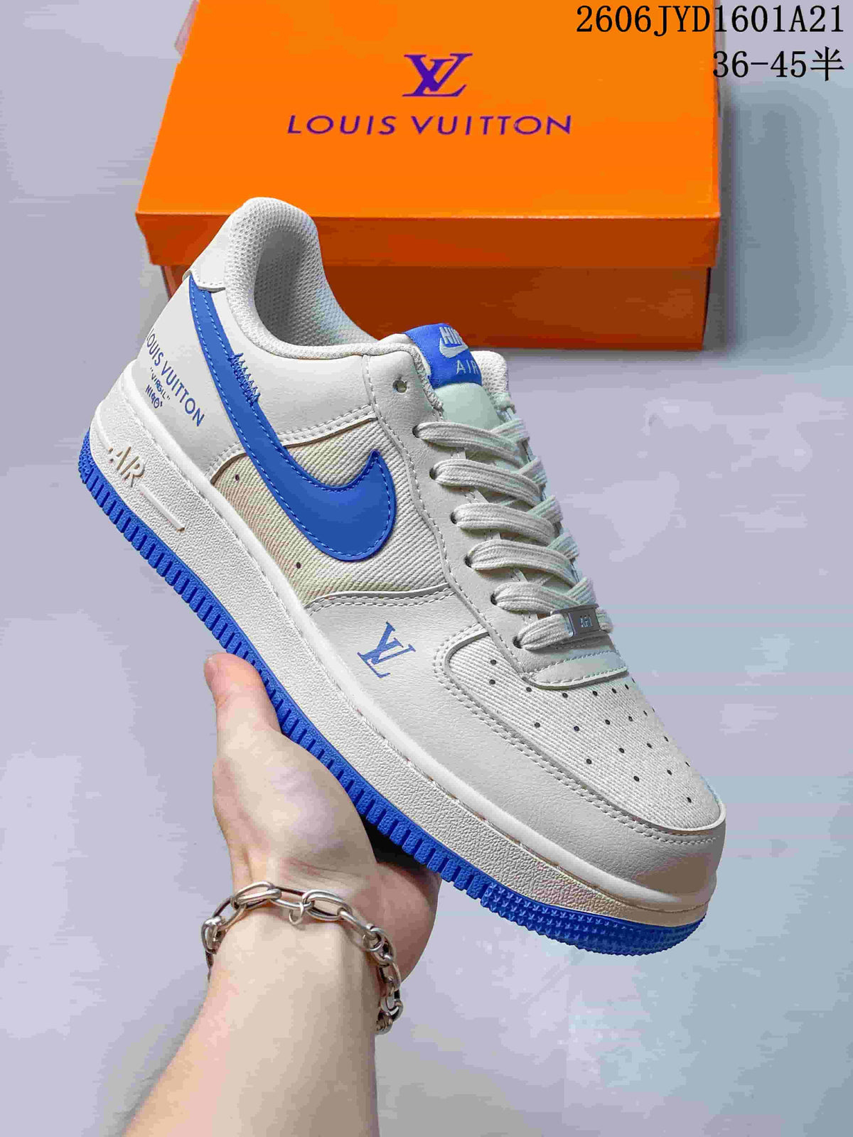 Angled side view of a white and blue low-top sneaker