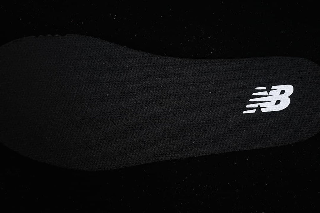 Close-up of the insole with a New Balance logo.