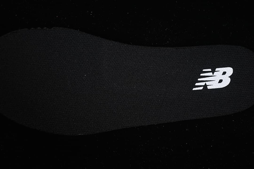 Close-up of the insole with a New Balance logo.