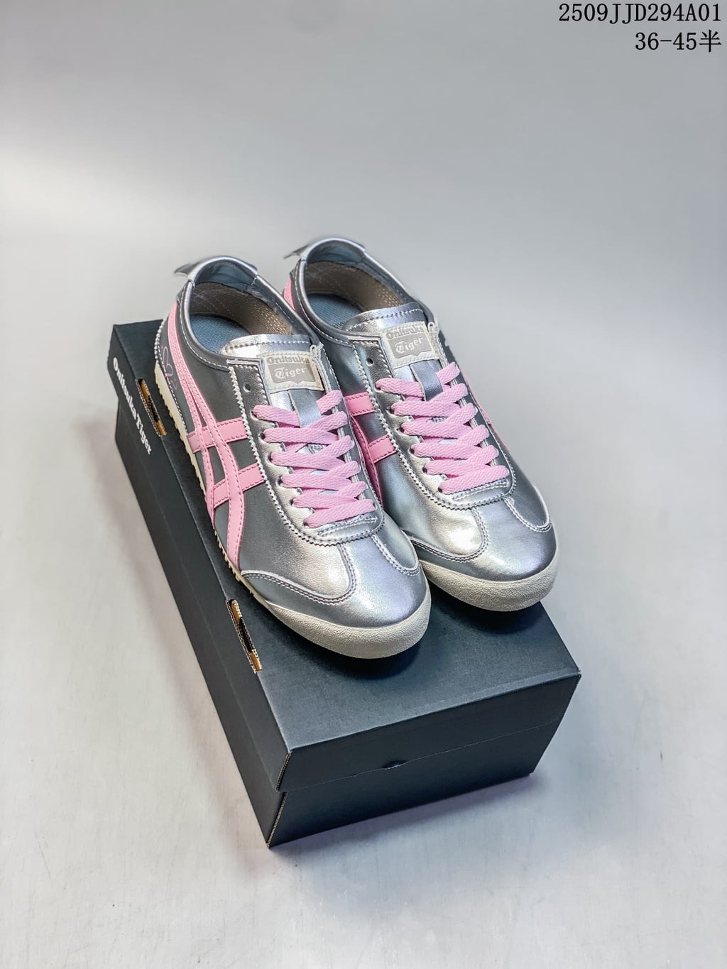 Pair of silver and pink Onitsuka Tiger low-profile sneakers on a shoebox