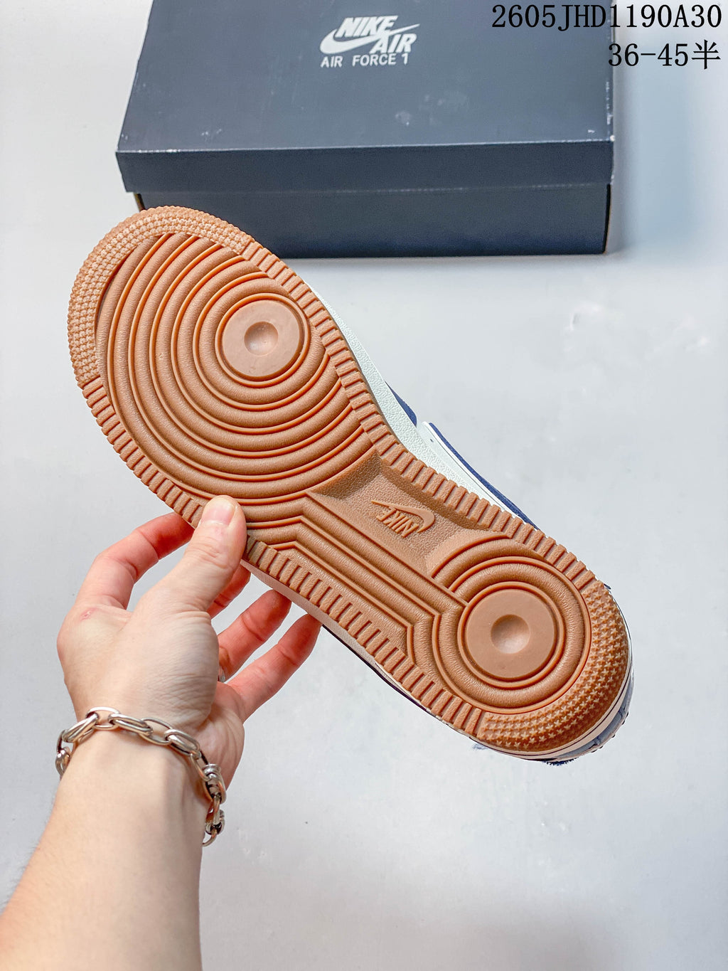 Close-up of the gum-colored outsole and circular tread pattern.