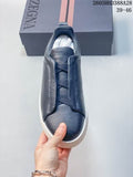 Top view of a navy Zegna Tiziano low-top sneaker with tonal laces and a white outsole; box shows size range 39–46.