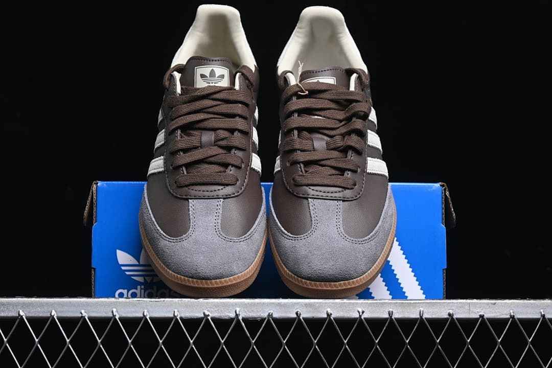Front view of the pair showing grey toe panels, brown laces and gum soles