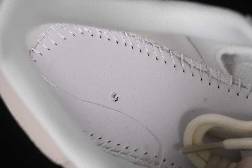 Close-up of interior stitching and lining inside the sneaker.