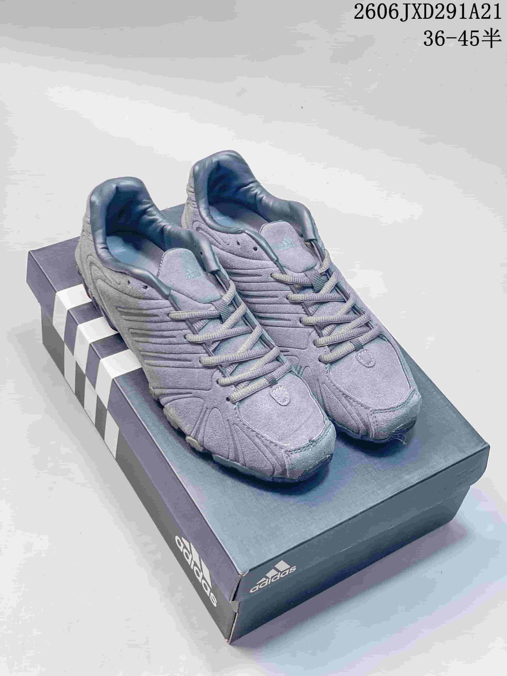 Pair of gray adidas Ghost Sprint sneakers shown from above on a shoebox.