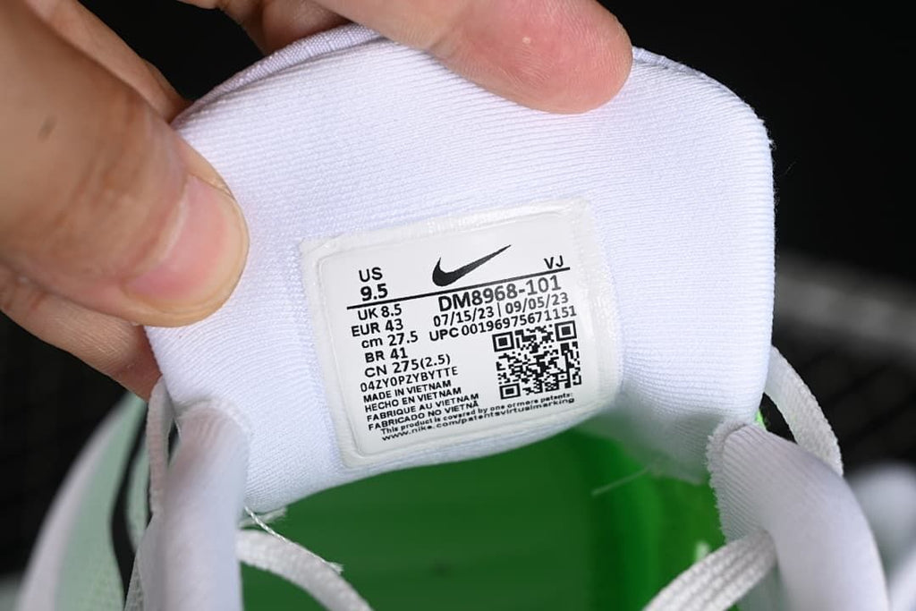 Shoe tongue label showing style code DM8968-101 and sample size EU 43