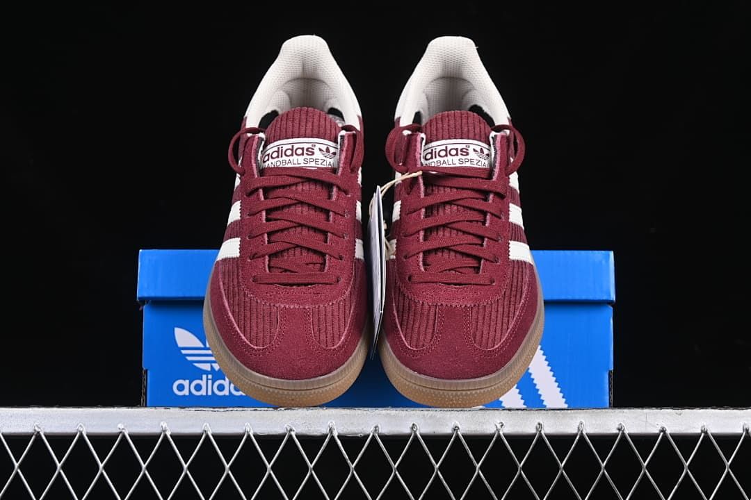 Front view of the pair displayed on a blue shoe box