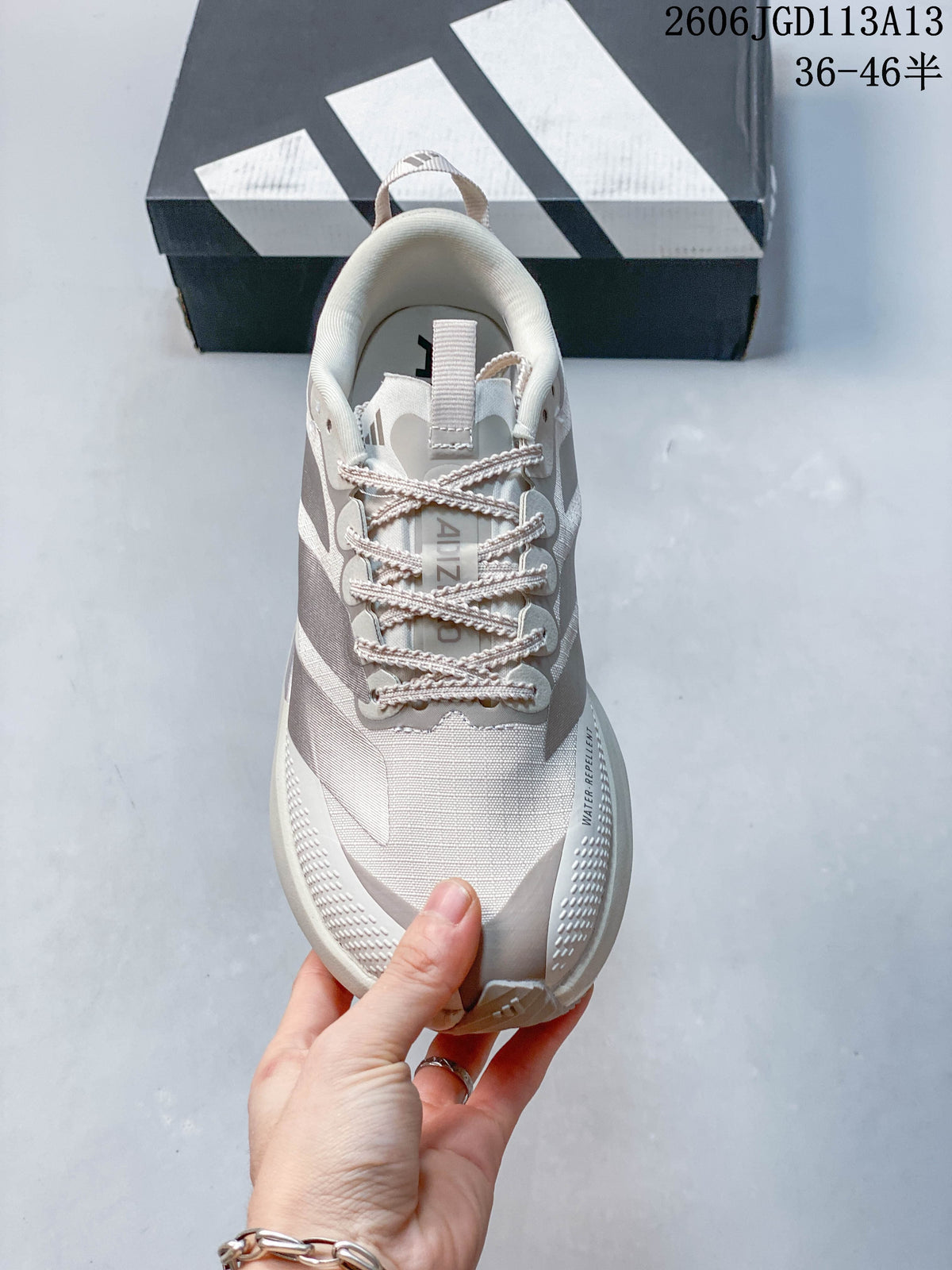 Top view showing the laces, tongue, and mesh-look upper of the Adidas running shoe