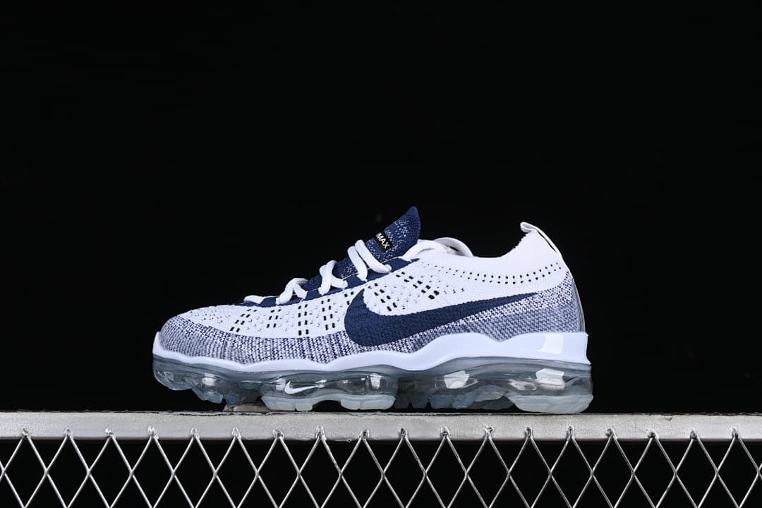 Side view of the Nike Air VaporMax sneaker against a dark background