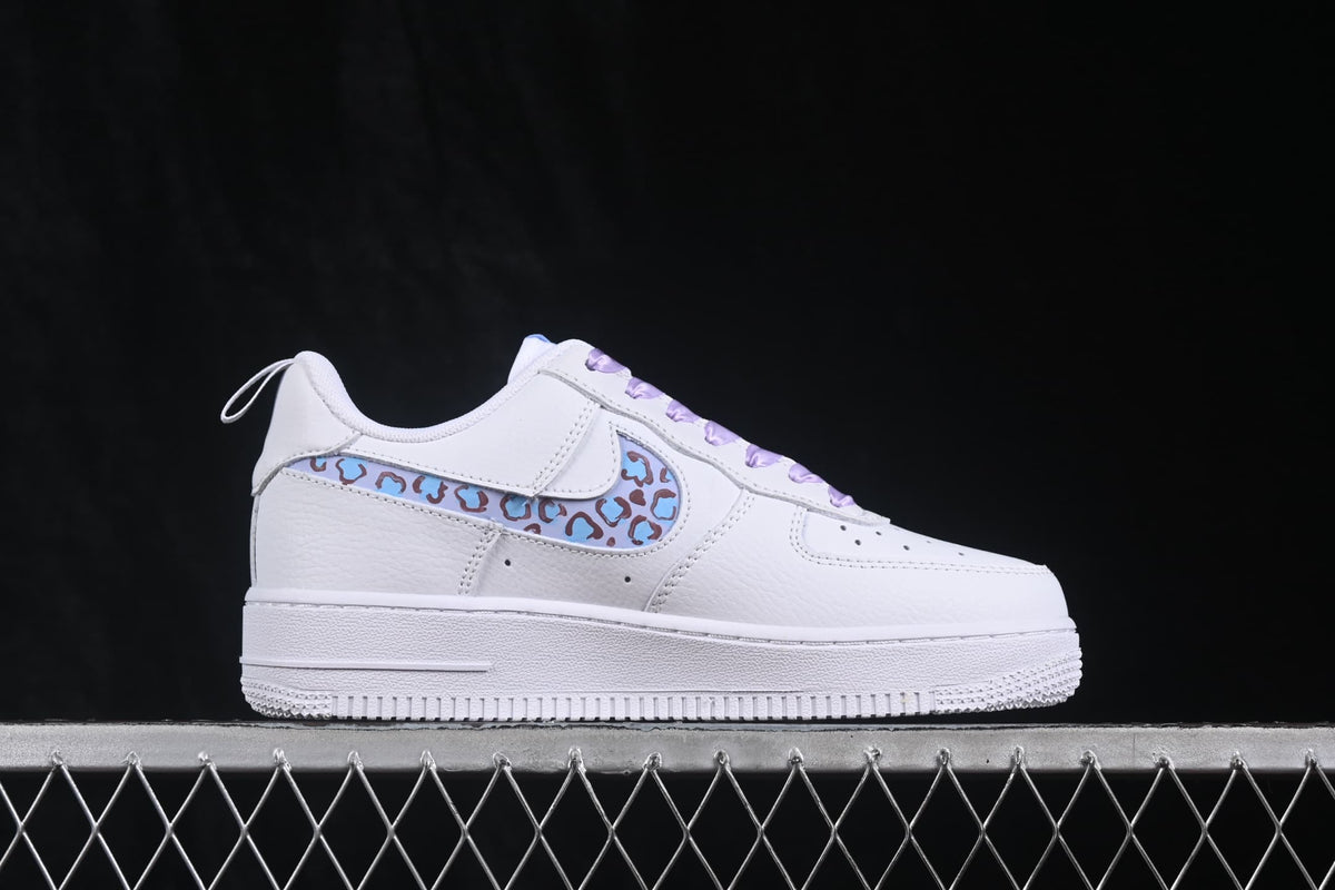 Opposite side profile showing the pale blue leopard-pattern Swoosh.