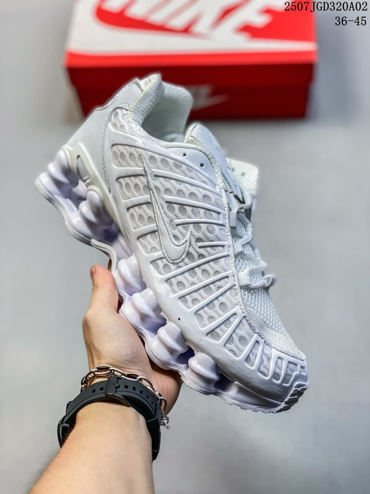 Angled side view of the white Nike Shox TL sneaker