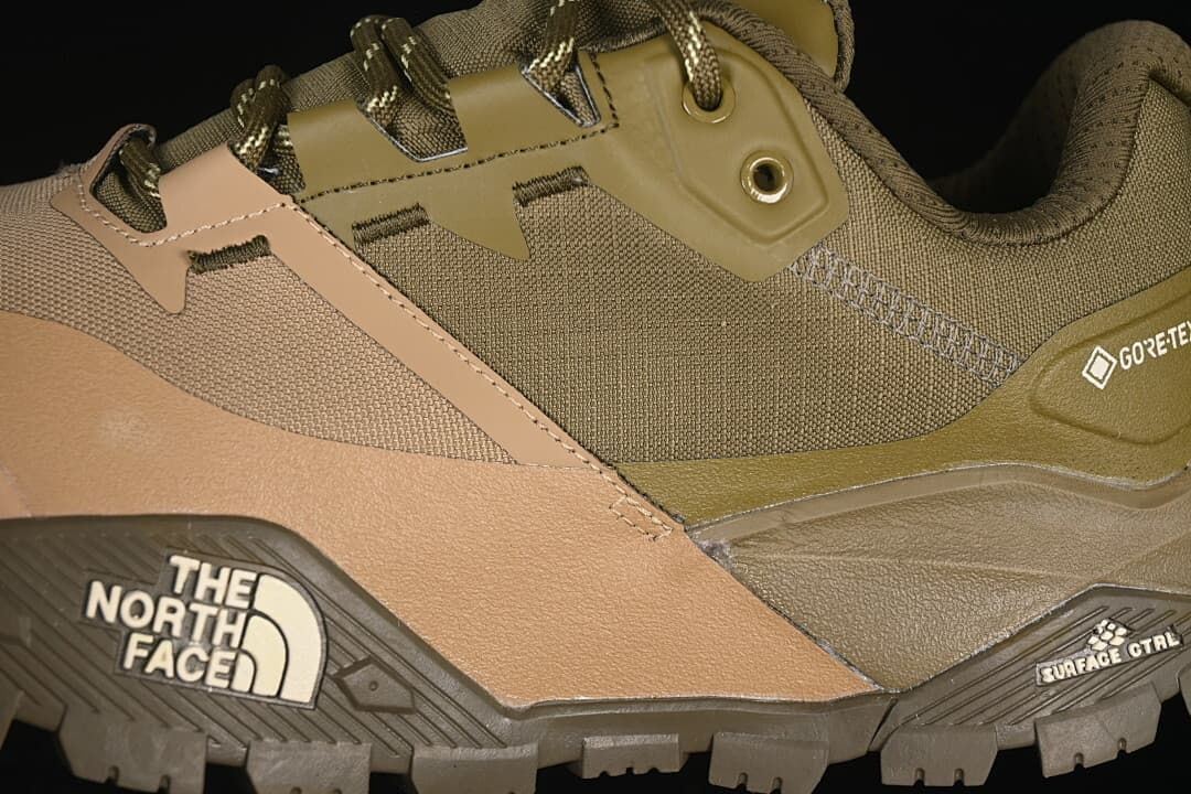 Close-up of side overlays, lacing hardware and outsole