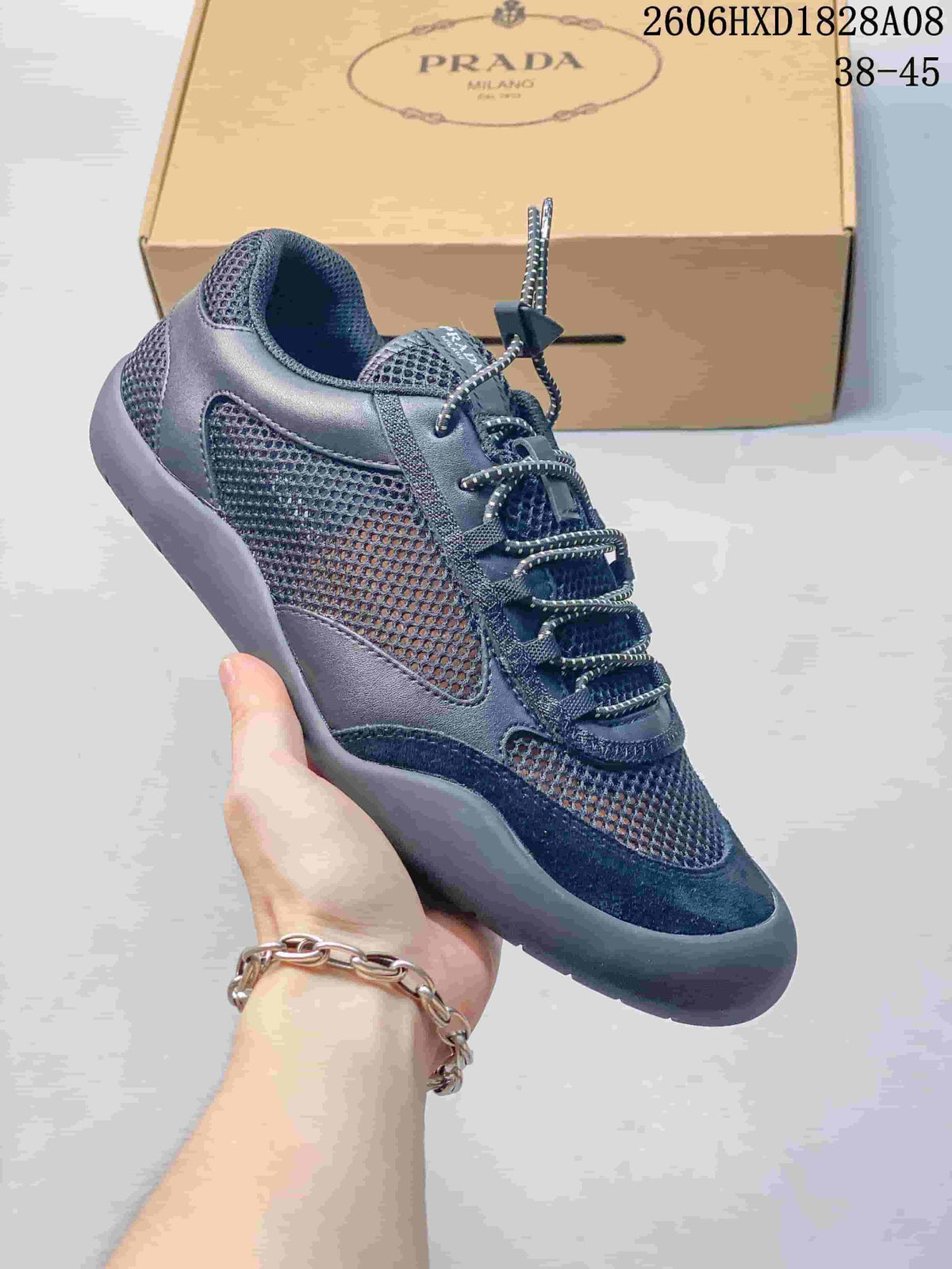 Angled view of a dark blue mesh sneaker with contrasting overlays and a chunky sole.