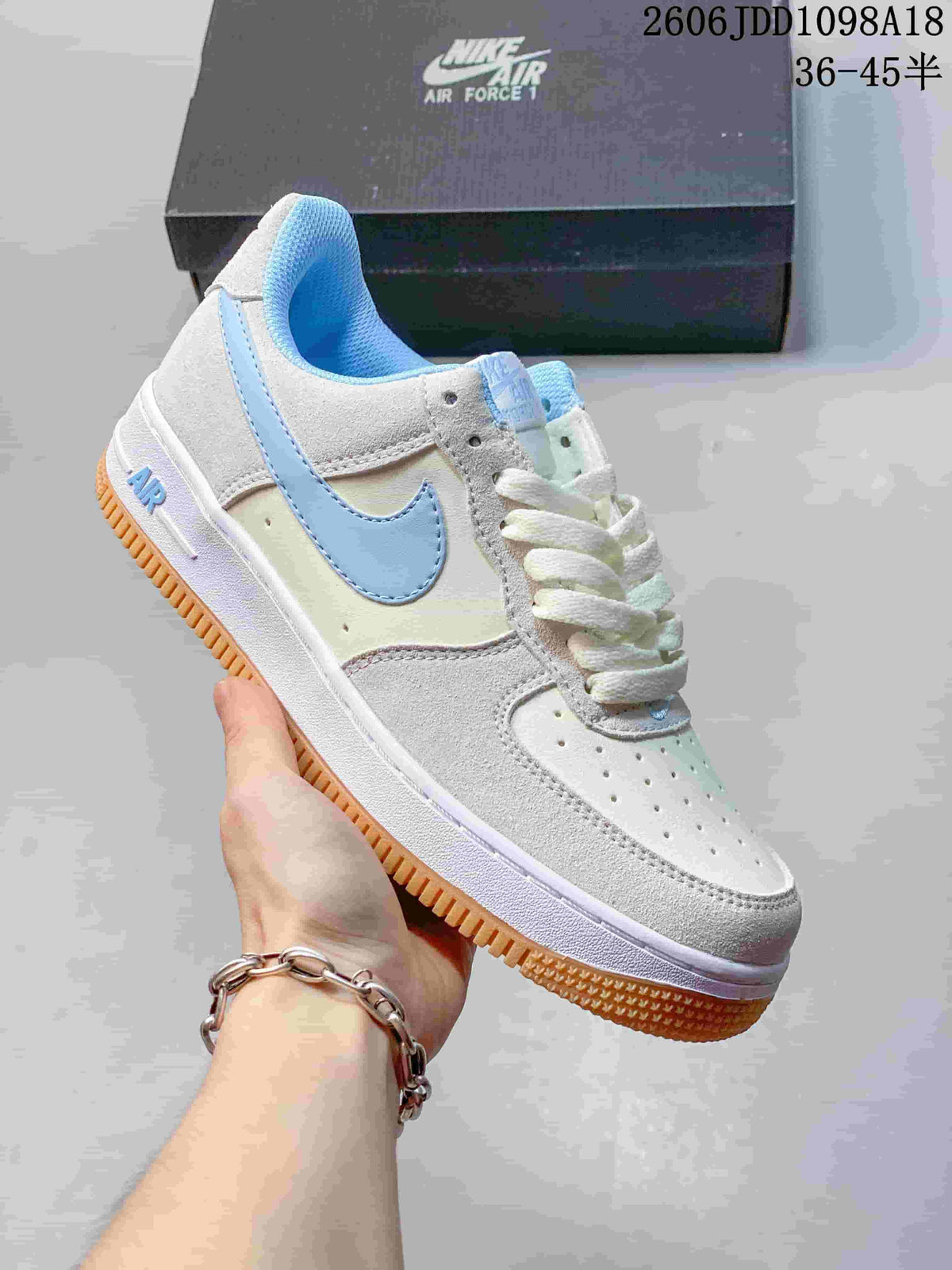 Angled side view of the low-top sneaker with a gum-colored outsole