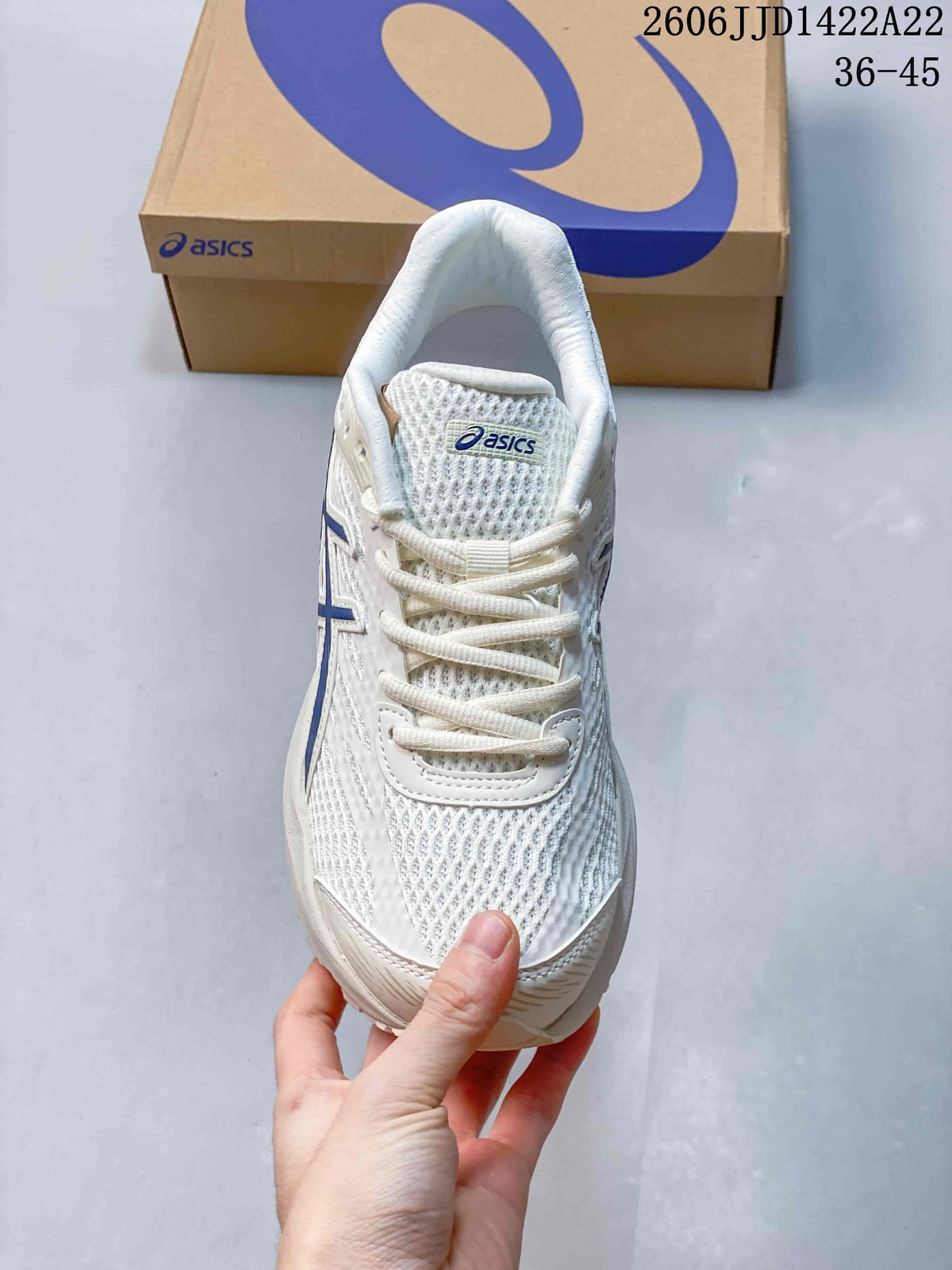Top view of the white mesh-look upper and laces
