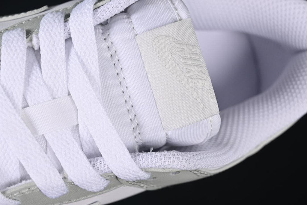 Close-up of white laces and tongue