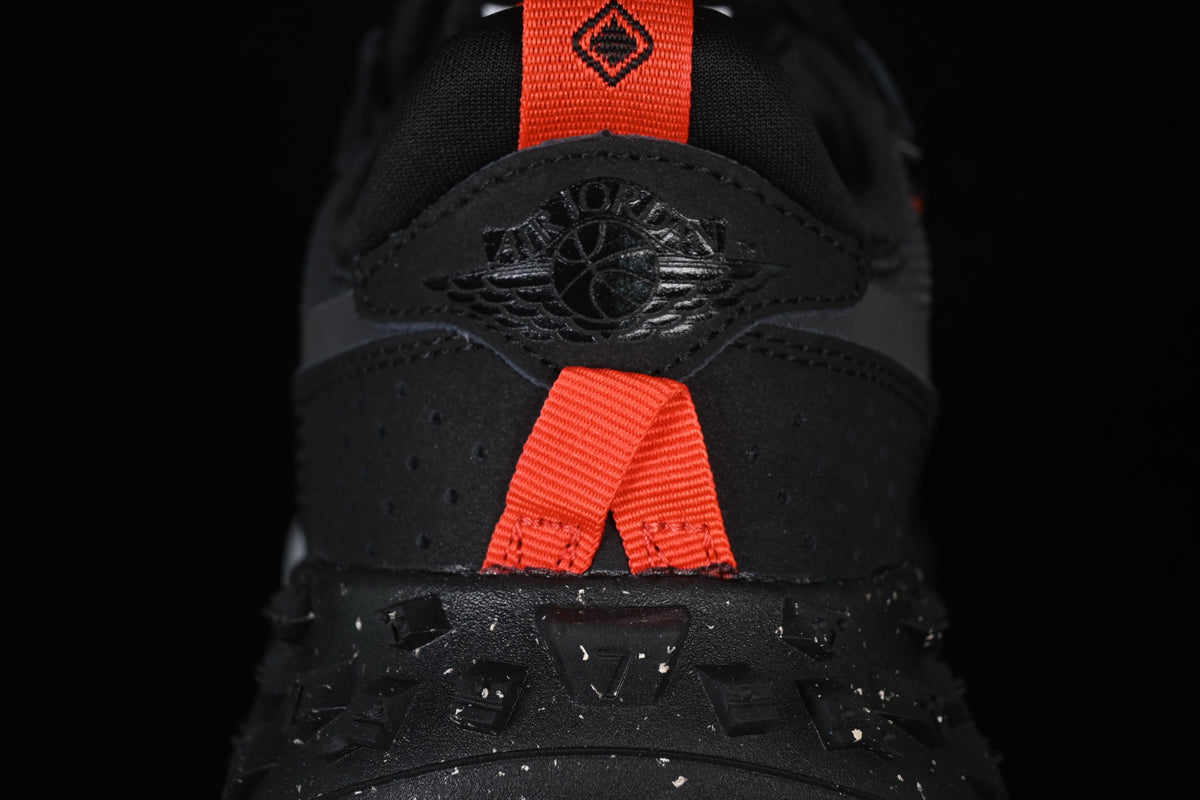 Close-up of the heel with an Air Jordan logo and bright orange pull tabs