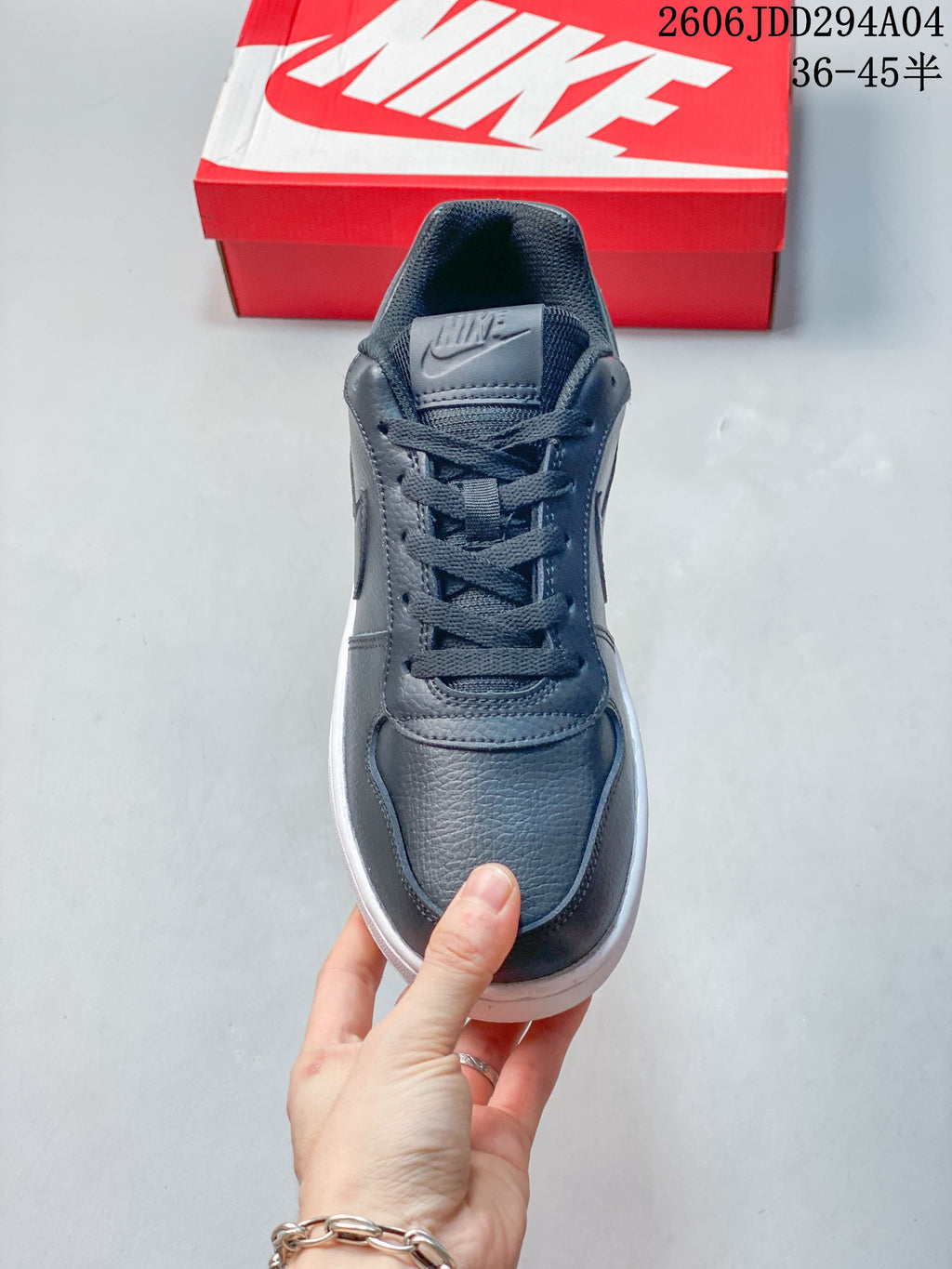 Front view of the dark gray lace-up sneaker