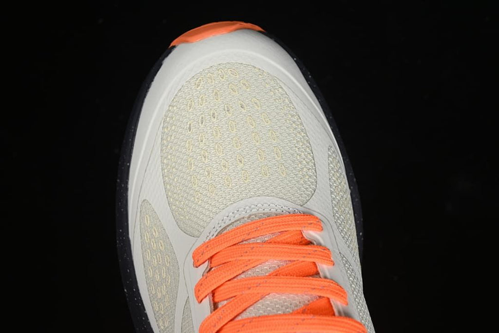 Top view of the textured off-white toe and orange laces