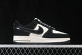 Side profile of black and off-white low-top sneakers with patterned laces and contrast stitching.