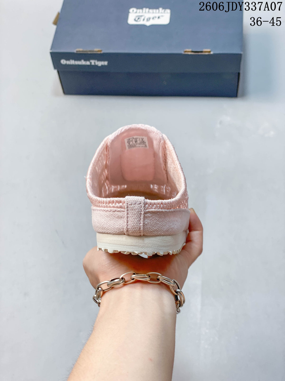 Rear view showing the open-back slip-on design of the pink shoe