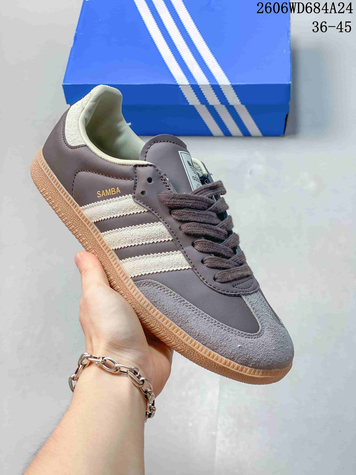 Gray and cream low-top sneaker with cream stripes and gum-style sole.