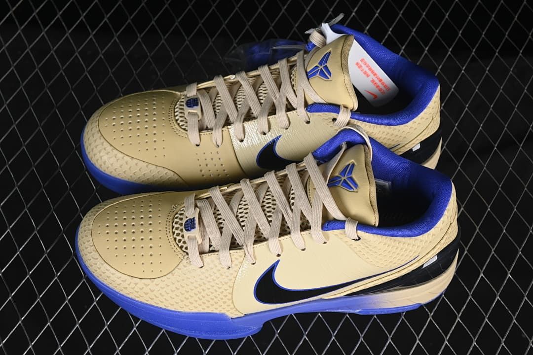 Pair of cream and blue shoes shown from above at an angle.