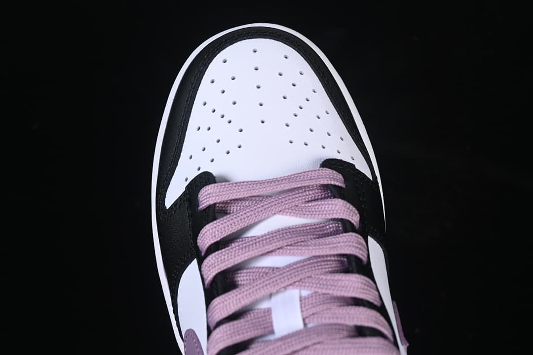 Top view of the perforated toe and purple laces