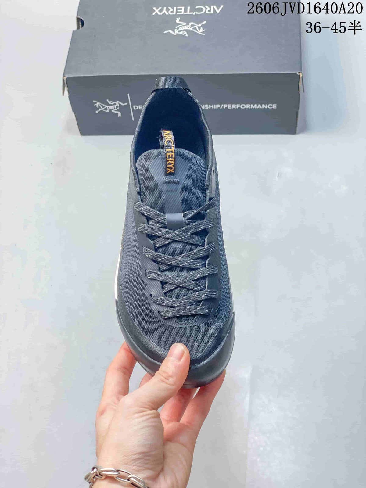 Top view of the gray trail shoe showing its laces and tongue