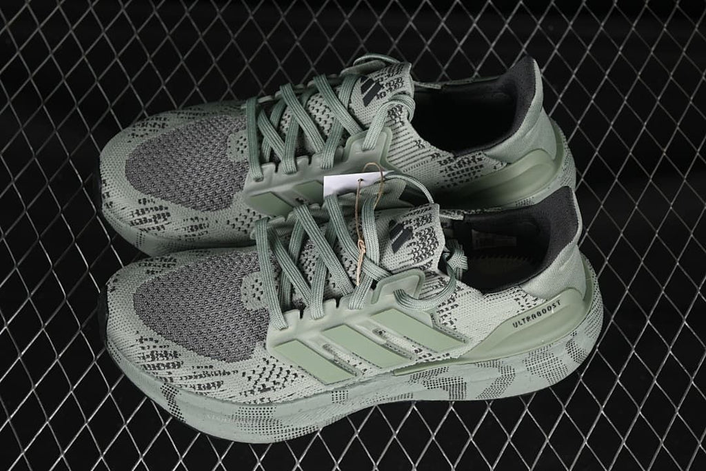 Pair of sage-green Ultraboost 5 shoes shown from above at an angle