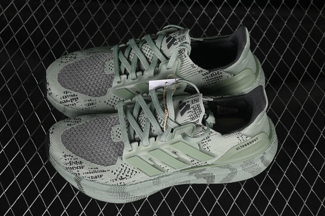 Pair of sage-green Ultraboost 5 shoes shown from above at an angle